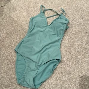 Cute one piece bathing suit in a light aqua blue